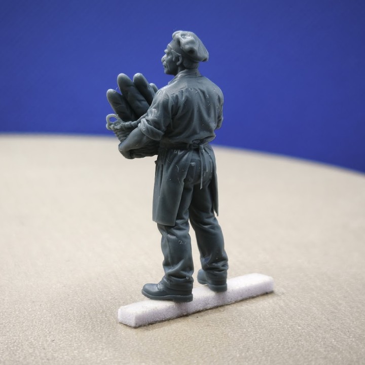 Diorama 3D Creative représentant un boulanger avec son panier de pains